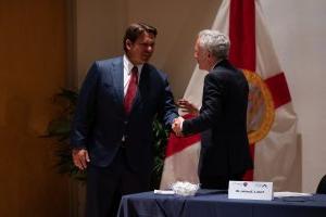 Governor Rick Scott shaking hands with Dr. Scott Atlas